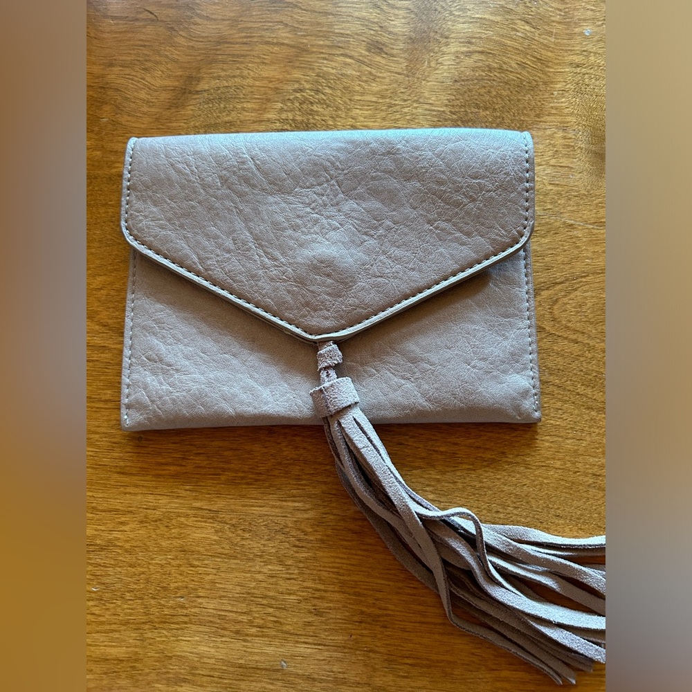 Like new: Cream/Beige Antik Kraft brand small leather clutch.